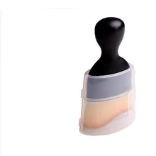 Makeup brush with black handle in clear storage case, full view