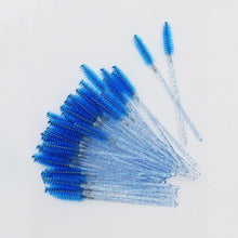 Blue disposable eyelash mascara wands with comb-like bristles on clear handles