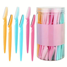 Eyebrow trimmer blades in mixed colors with clear storage jar