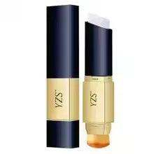 Pair of double-ended concealer sticks with navy caps and gold base, side view