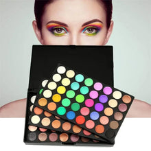 Colorful eyeshadow palette with multiple round shade pans in bright and neutral tones