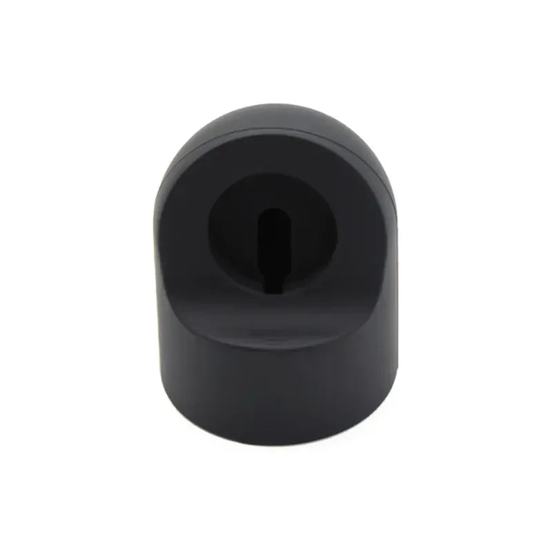 Black silicone charging stand with central slot for smartwatch charger cable