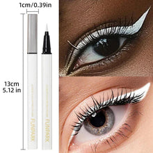 White liquid eyeliner pen with size marks and a white winged eyeliner line on an eye