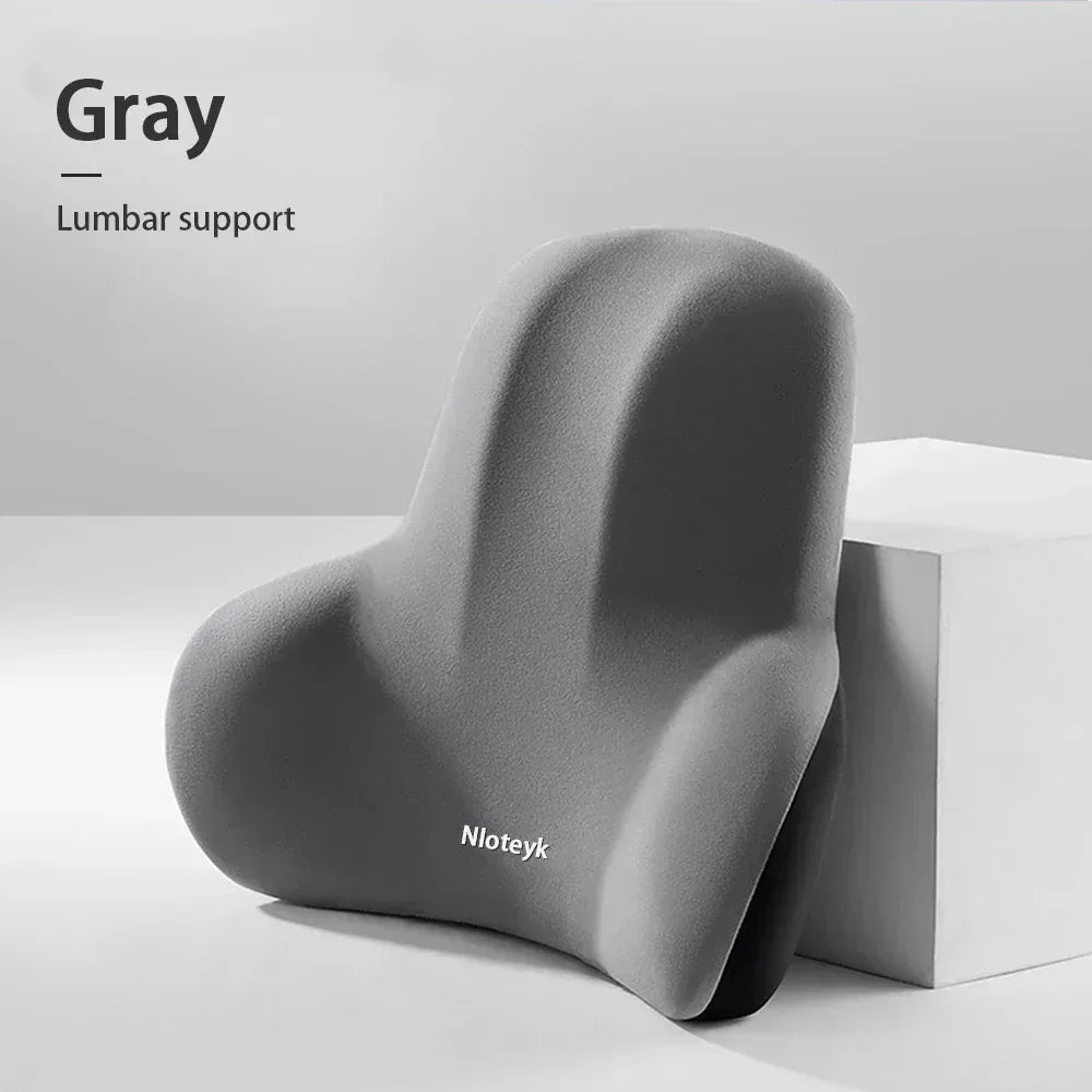 Car lumbar back support cushion in memory foam, gray, contoured.