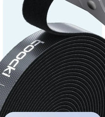 Close-up of black cable organizer wire tie roll with embossed markings