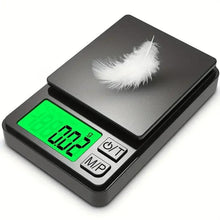 Digital pocket scale with dark platform and backlit green LCD display