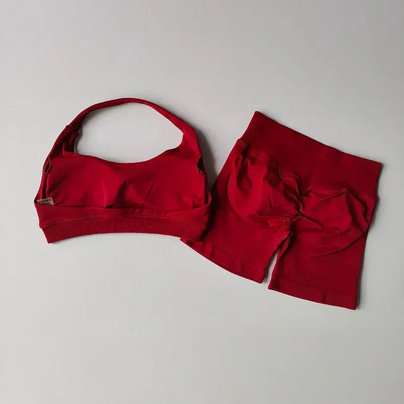 Red sports bra and high-waist shorts set with gathered front detail