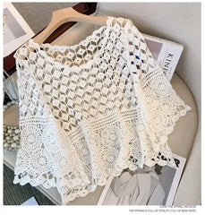 White crochet lace cover-up top with open geometric pattern and scalloped sleeve edges