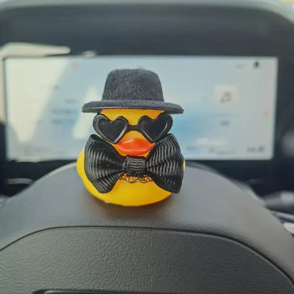 Groom duck car ornament with black top hat, heart-shaped glasses, yellow bow