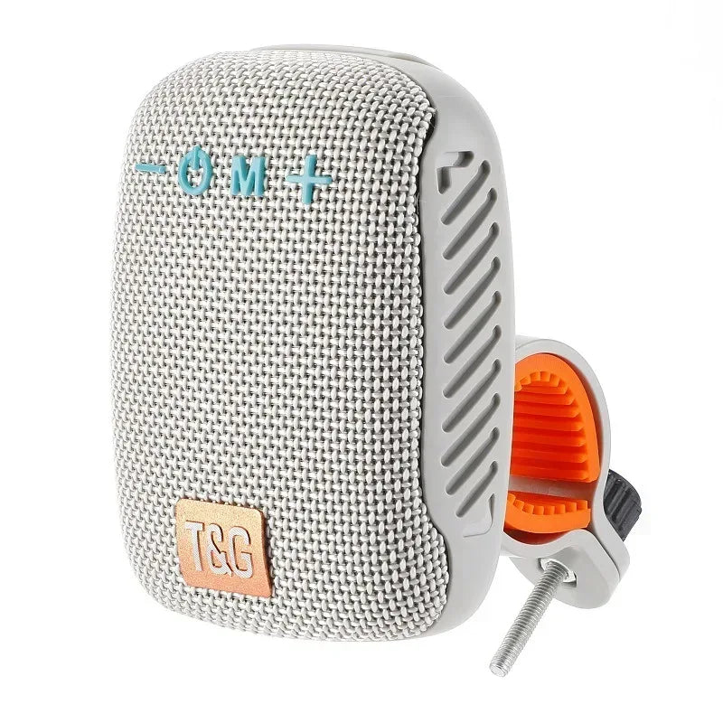 Outdoor Bluetooth speaker with light gray fabric and handlebar mount clip.