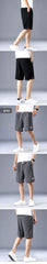 Men's drawstring silk shorts shown in black and gray on models