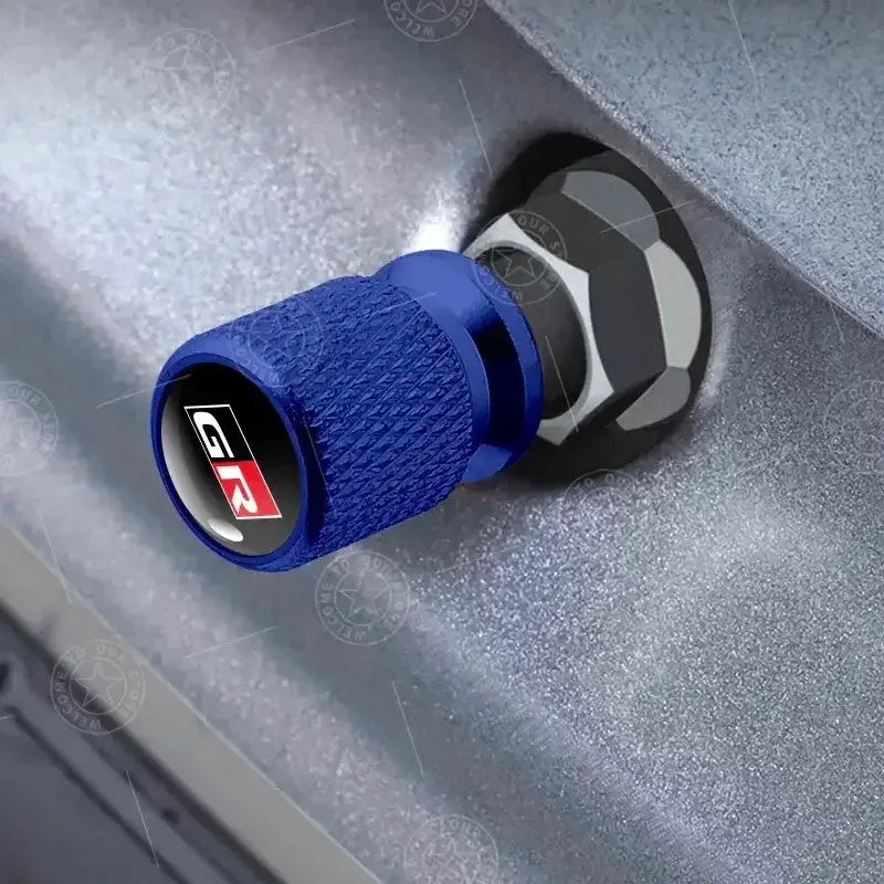 Blue GR SPORT logo aluminum valve cap with knurled texture and black inner insert