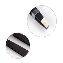 Slant-tip eyebrow tweezers with black handle and silver metal tip, close-up