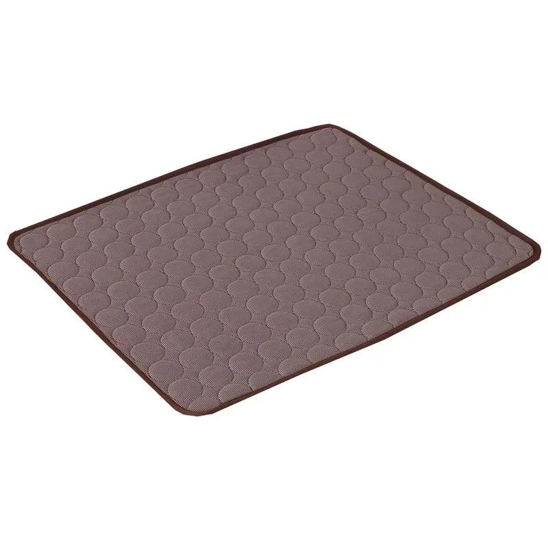 Dark grey cooling mat with raised honeycomb texture and dark border trim.