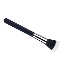 Powder brush side view with dark handle, silver ferrule, white bristles