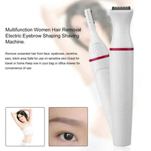 Women’s hair removal trimmer with wide black grooming head, white with red band