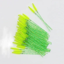 Disposable eyelash brush comb wands with neon green bristles and crystal clear handles