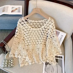 White crochet lace half-sleeve top with open diamond pattern and lace trim