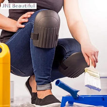 Blue knee protection pad with gray cap and black strap on jeans during work.