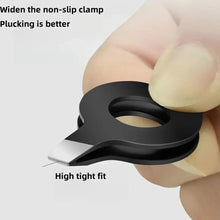 Black eyebrow tweezers with non-slip clamp tip, close-up held in fingers
