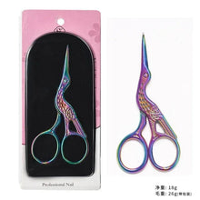 Iridescent nail scissors with purple and blue metal accents, round finger loops.