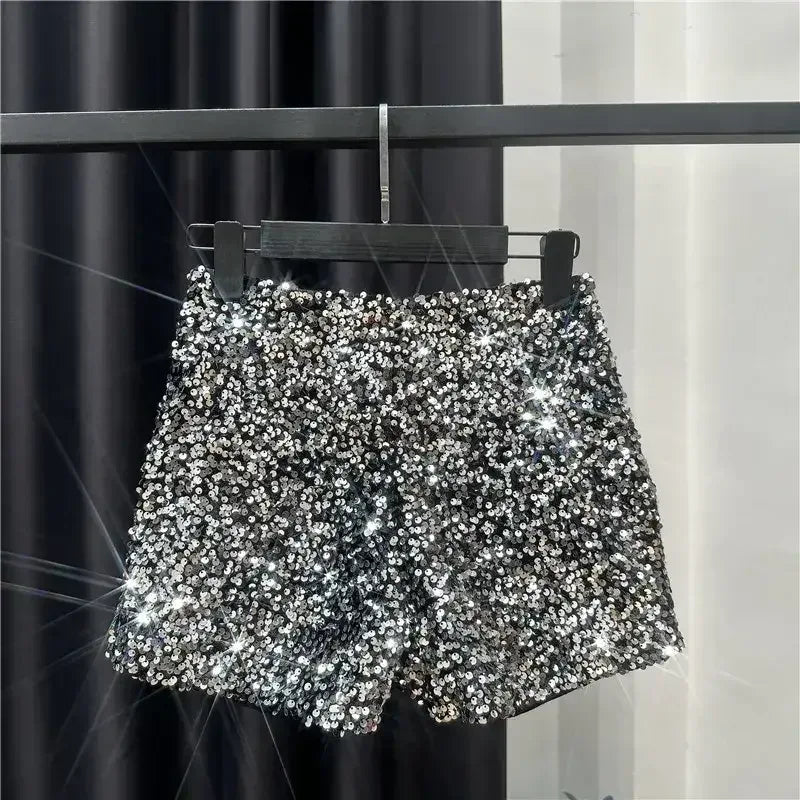 Silver sequined shorts with all-over shiny sparkle and scalloped hem