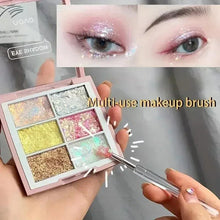 Multi-use makeup brush with transparent handle and silver stem, white tip with colored head