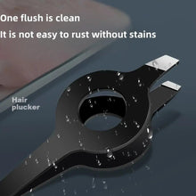 Black eyebrow tweezers with water droplets on the tips and clamp