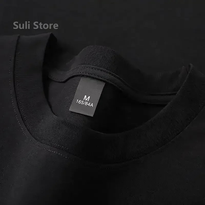 Dark gray crew-neck cotton T-shirt, ribbed neckline, short sleeves, inner label