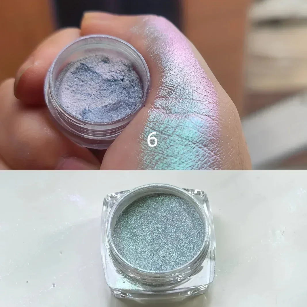 Seafoam green metallic glitter eyeshadow jar with light blue shimmer swatch