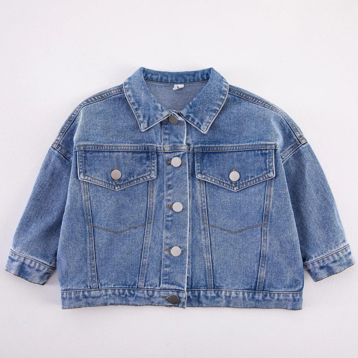 Children's light blue denim jacket with button front and flap chest pockets