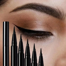 Black liquid eyeliner set with slim applicators, winged eye line on eye