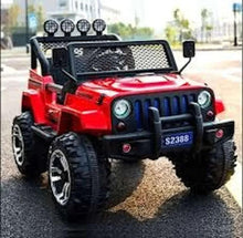Red electric ride-on jeep outdoors with roof light bar, front grille, and large rugged tires