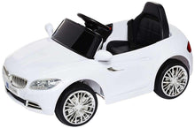 White kids electric ride-on car with black seats, front-left view, chrome wheels.