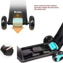 Kids tricycle brake close-up with black wheels and turquoise wheel housing