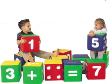 Children playing with number foam blocks, holding blocks marked 1 and 5