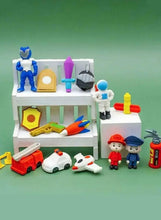 Mini character eraser display with figures and accessories on white shelf