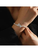 Silver-tone crystal butterfly bracelet with three butterfly charms