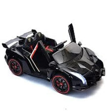 Black 2-seater ride-on electric car, angled view with front lights and red wheels