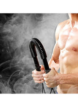Black coiled spring arm trainer held in hands with loop strap ends