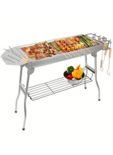 Stainless steel BBQ grill with side hooks and lower warming rack, food on top grate