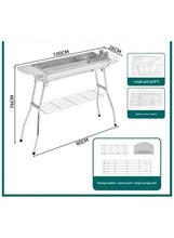 Portable charcoal BBQ grill with two-tier cooking racks and storage basket