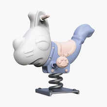 Children dog spring rider, angled view: white dog figure, blue seat, black coiled spring