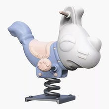 Children dog spring rider, side view: white dog, blue seat, and black coiled spring base