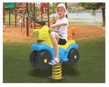 Spring rider vehicle in blue and yellow-green with black wheels and yellow coil spring; child seated.