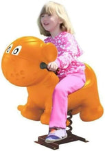 Children riding orange cartoon dog spring rider with dark base and spring