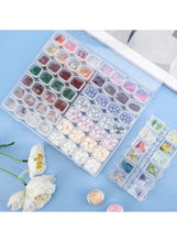 Transparent 56-grid storage case with compartments holding assorted beads and pearls