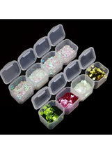 Transparent organizer case with lid and multiple small compartment inserts for supplies
