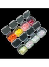 Transparent plastic storage box with hinged lid and 56 square compartments filled