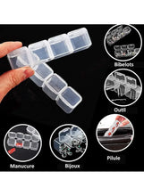 Transparent 56-grid storage box showing small hinged compartment lids